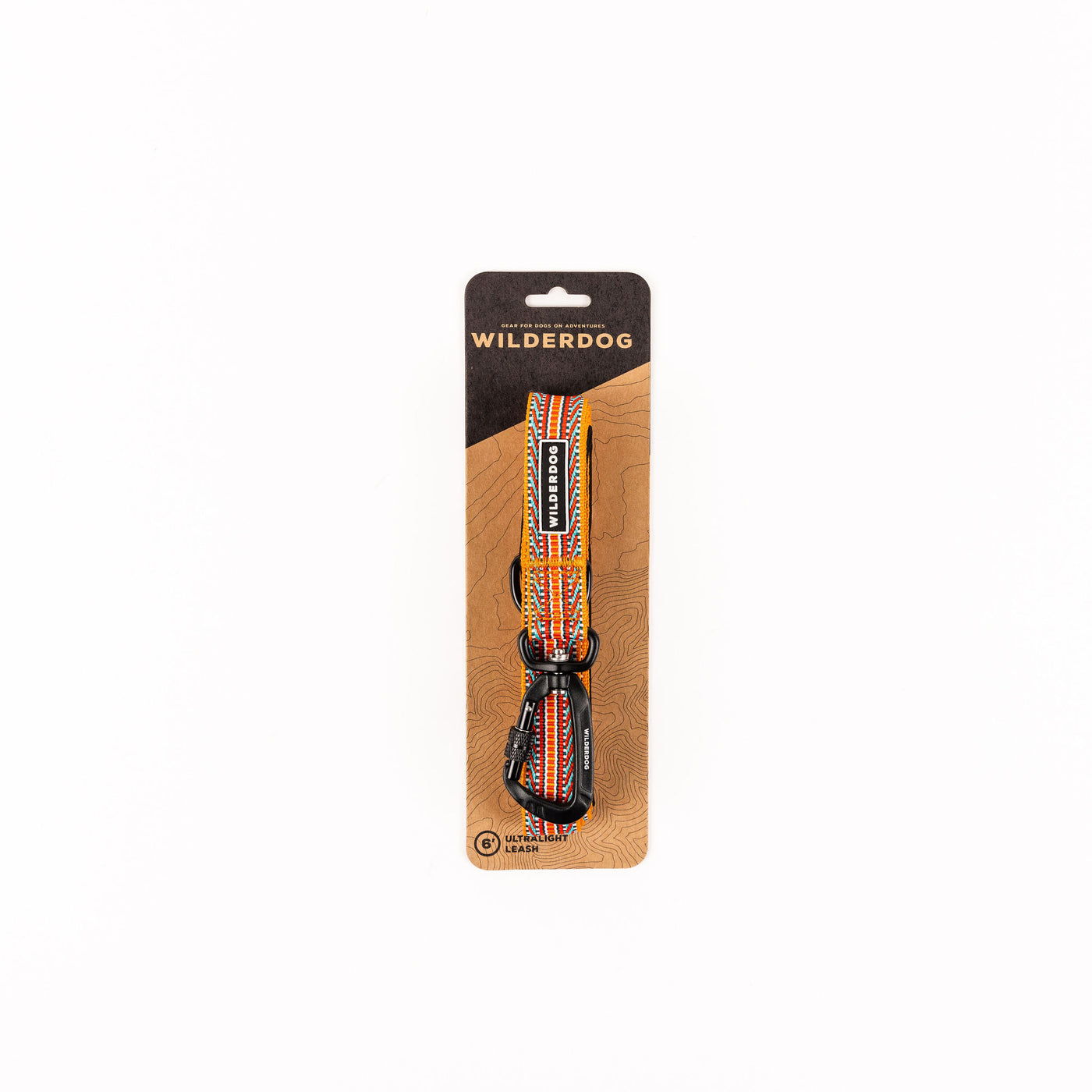 A packaged Sienna Ultralight Leash with an intricate, multi-colored design is displayed against a white background. The packaging features a top hole for hanging and the brand name "Wilderdog" prominently at the top. The leash's strong nylon webbing suggests exceptional durability and style.

